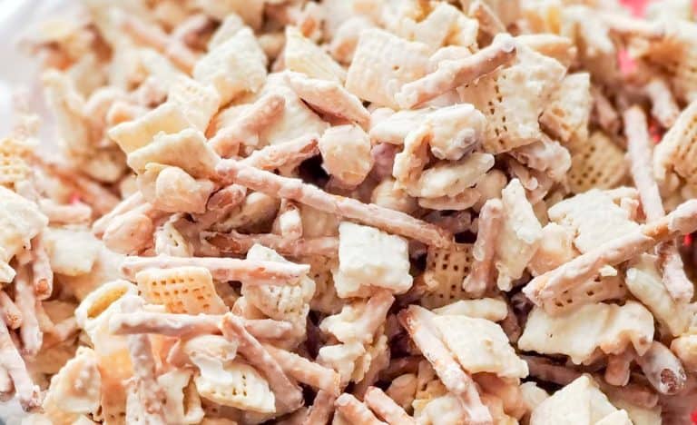 Close-up shot showing the texture of the coated Chex mix.