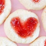 Close-up of a jam-filled heart cookie.