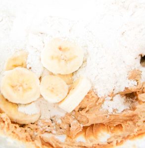 Banana slices and flour added to dough for Peanut Butter Banana Cookies.